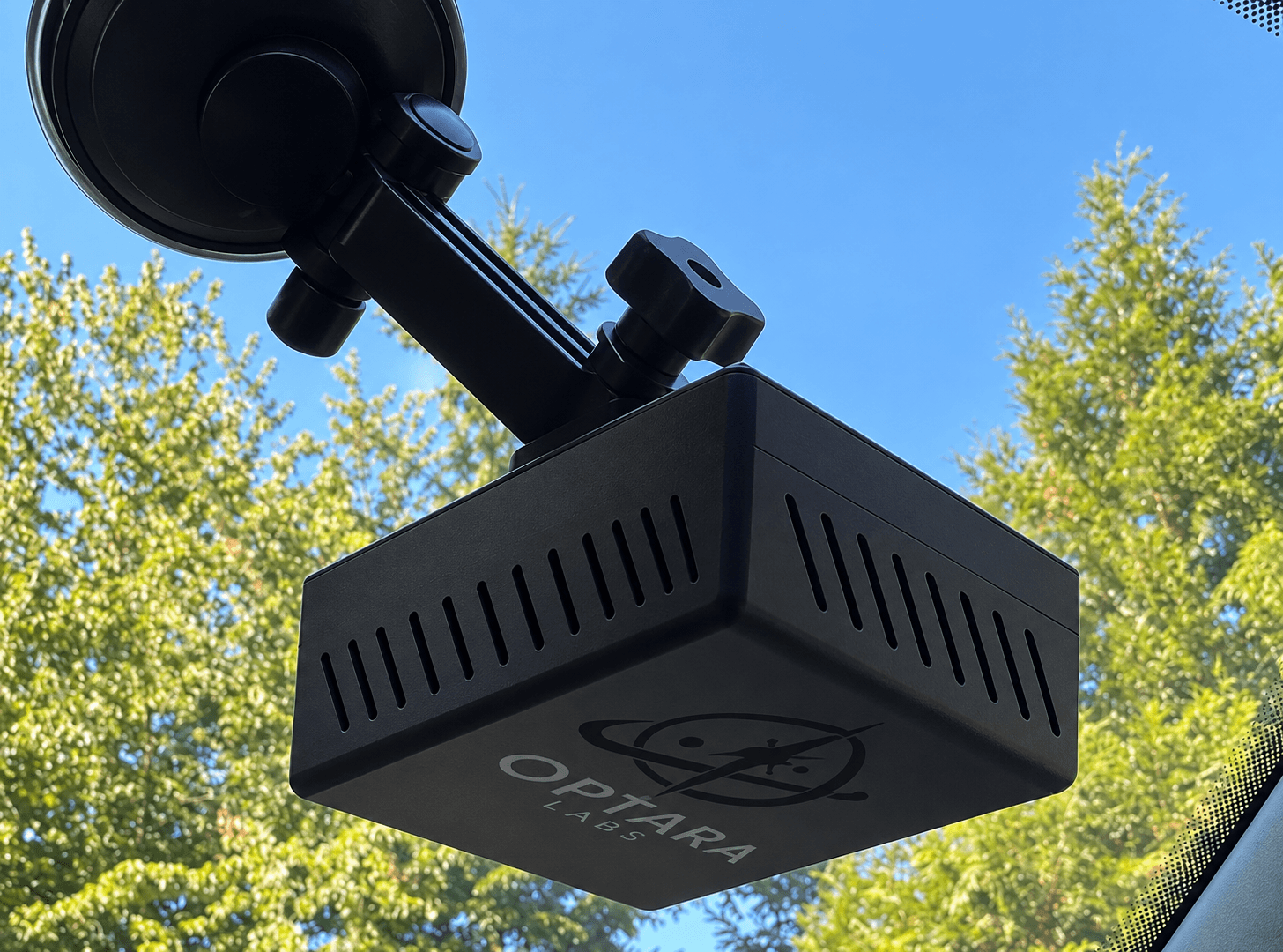 Optara Edge AI Field Unit mounted on a vehicle windshield during a real drive